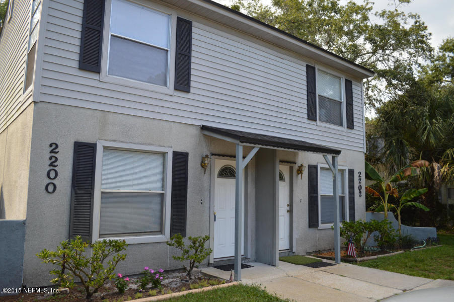 2200 Marsh Point Road Neptune Beach, FL 32266 - Photo 1 of 13 a front view of a house with garden