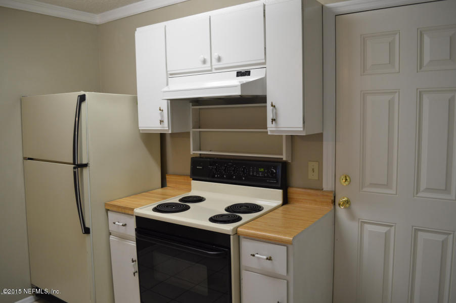 2200 Marsh Point Road Neptune Beach, FL 32266 - Photo 13 of 13 a kitchen with a stove and a refrigerator