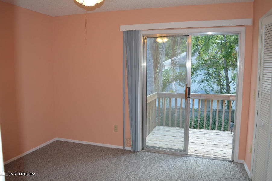 2200 Marsh Point Road Neptune Beach, FL 32266 - Photo 4 of 13 an empty room with wooden floor and windows
