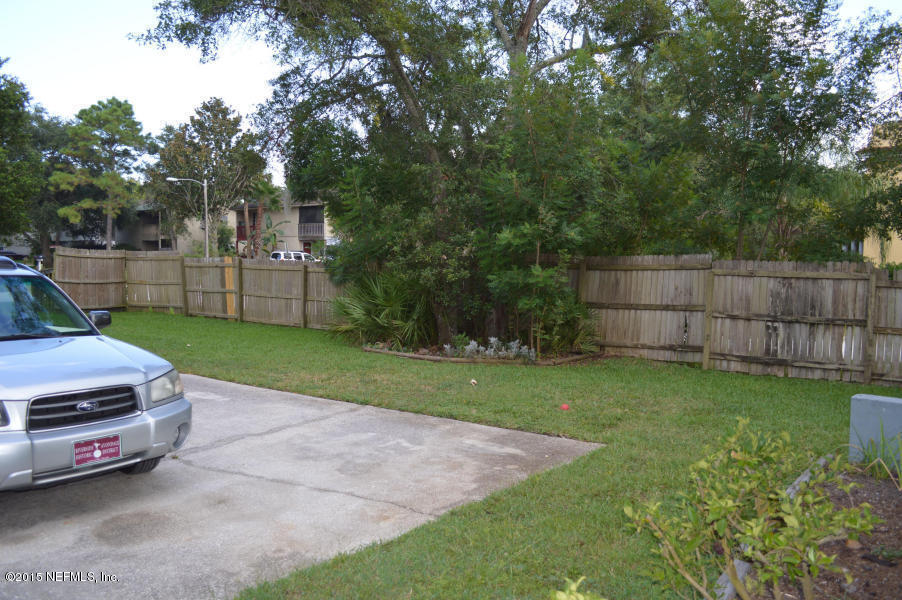2200 Marsh Point Road Neptune Beach, FL 32266 - Photo 6 of 13 a view of a backyard with wooden fence