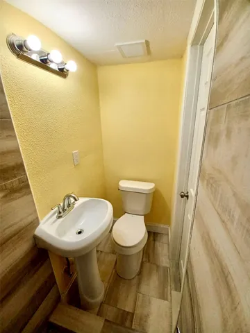 a bathroom with a sink and a toilet