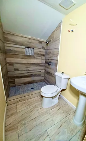 a bathroom with a toilet and a sink