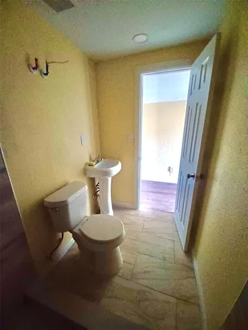 a bathroom with a sink and toilet