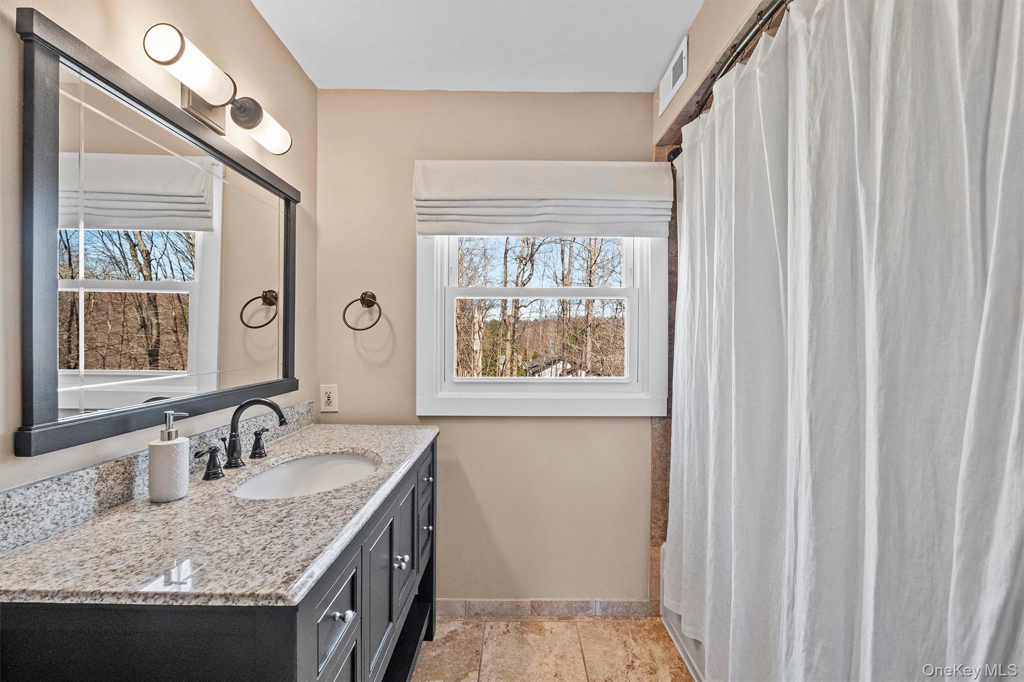 76 Smith Hill Road Monsey, NY 10952 - Photo 30 of 50 a bathroom with a granite countertop sink and a window