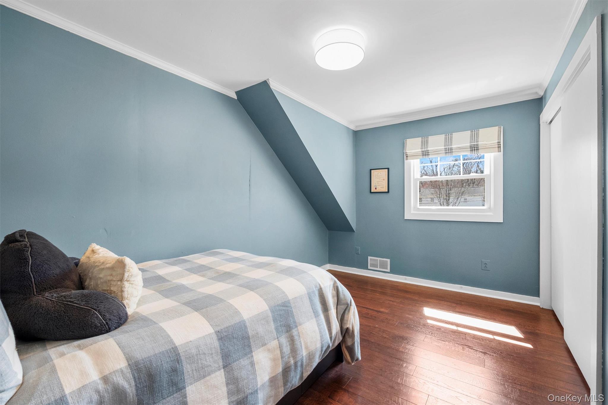 76 Smith Hill Road Monsey, NY 10952 - Photo 34 of 50 a bedroom with a bed and wooden floor
