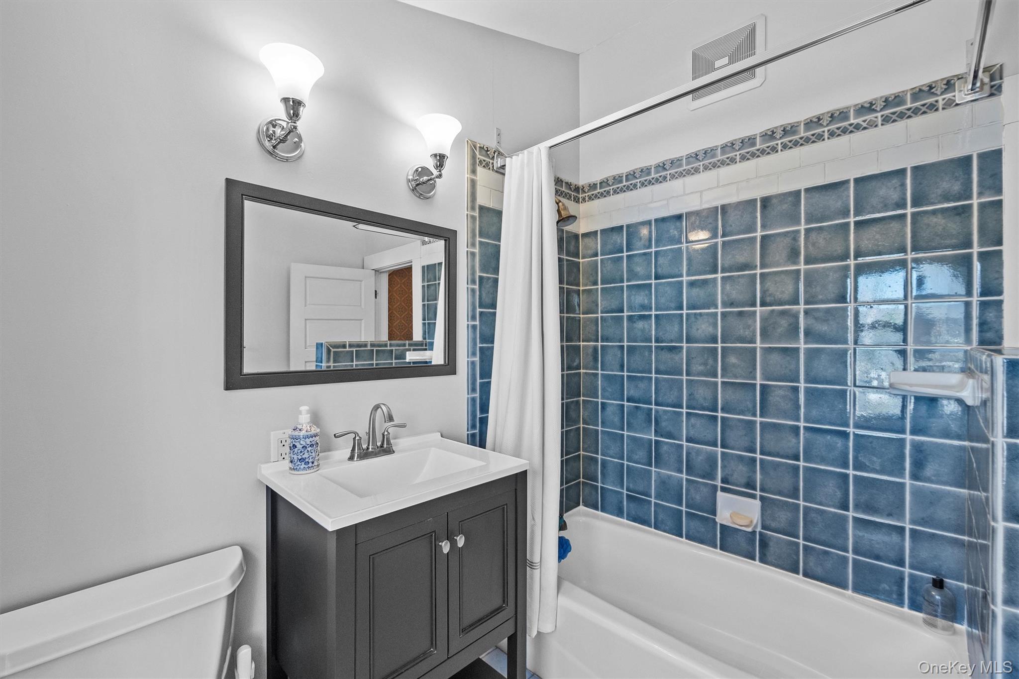 76 Smith Hill Road Monsey, NY 10952 - Photo 35 of 50 a bathroom with a sink mirror toilet and bathtub