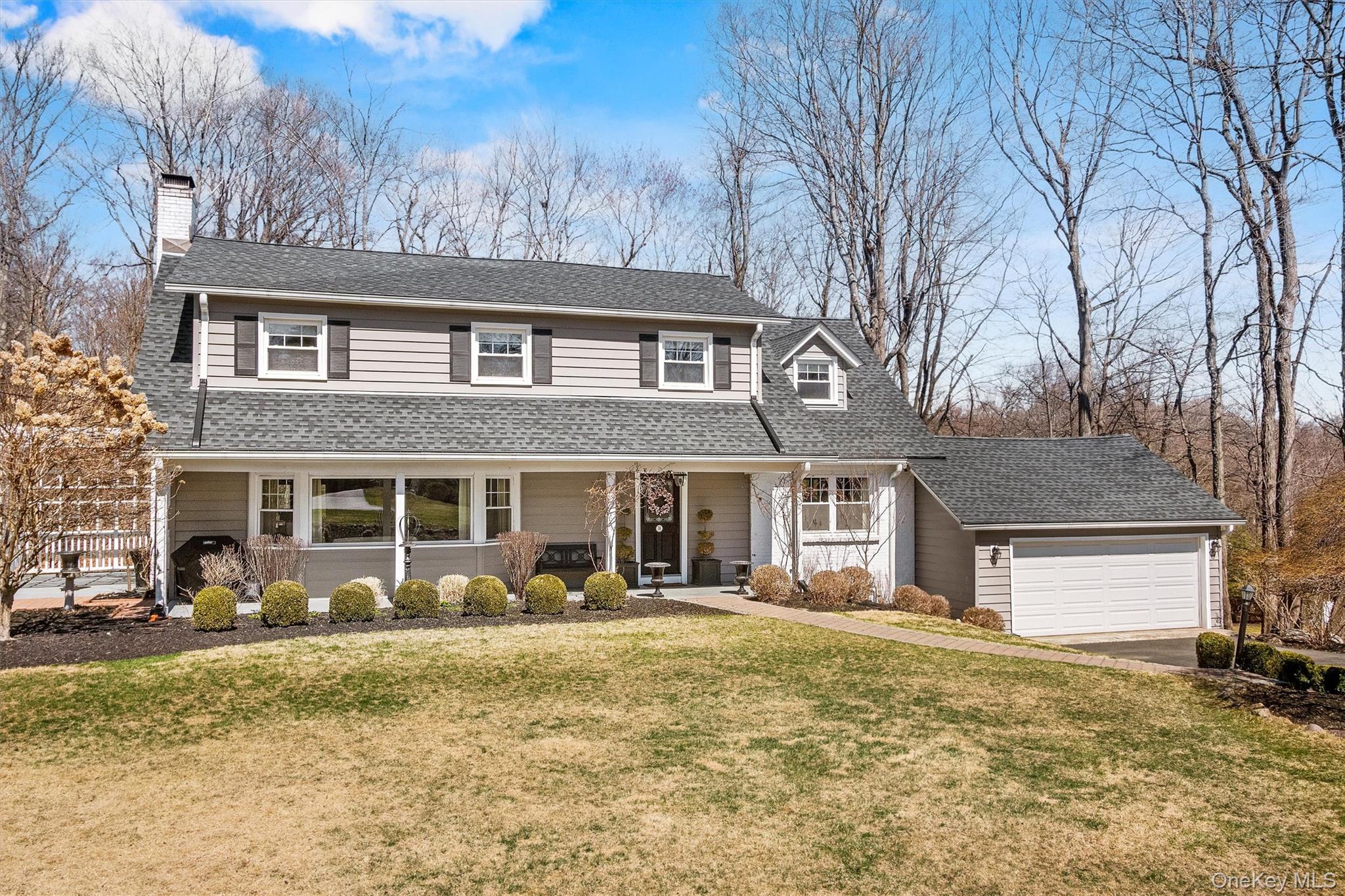 76 Smith Hill Road Monsey, NY 10952 - Photo 4 of 50 a front view of a house with garden