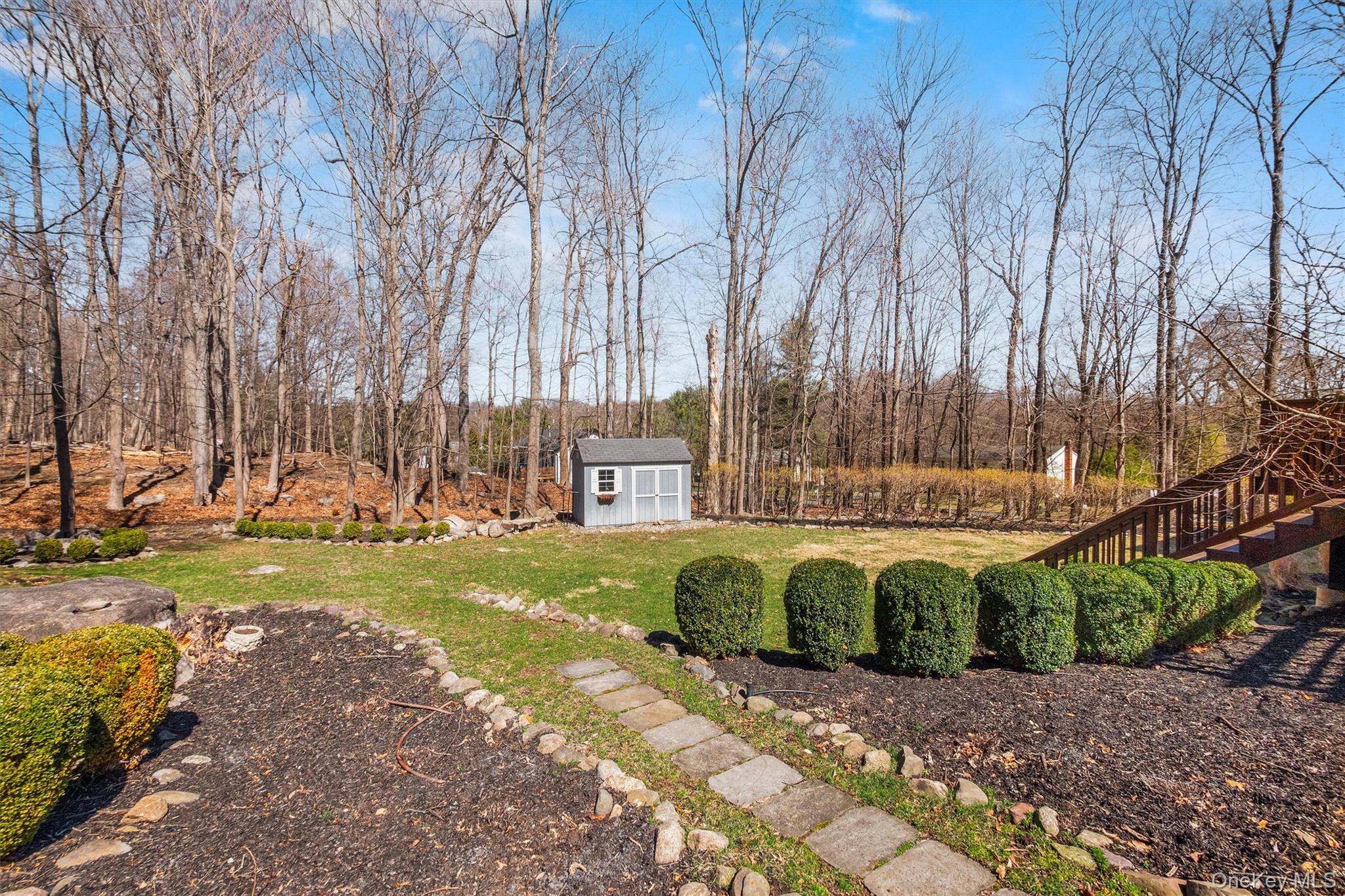 76 Smith Hill Road Monsey, NY 10952 - Photo 45 of 50 a view of a garden with large trees