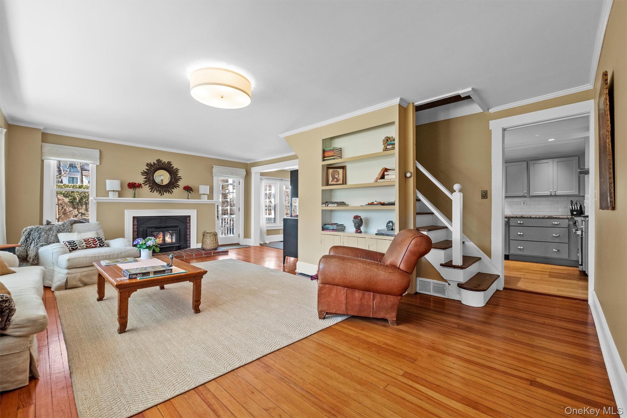 76 Smith Hill Road Monsey, NY 10952 - Photo 8 of 50 a living room with furniture a fireplace and a flat screen tv