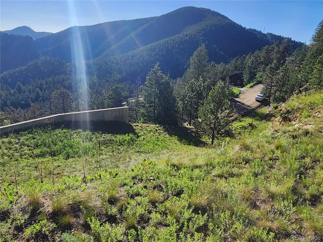 a view of mountains and valleys