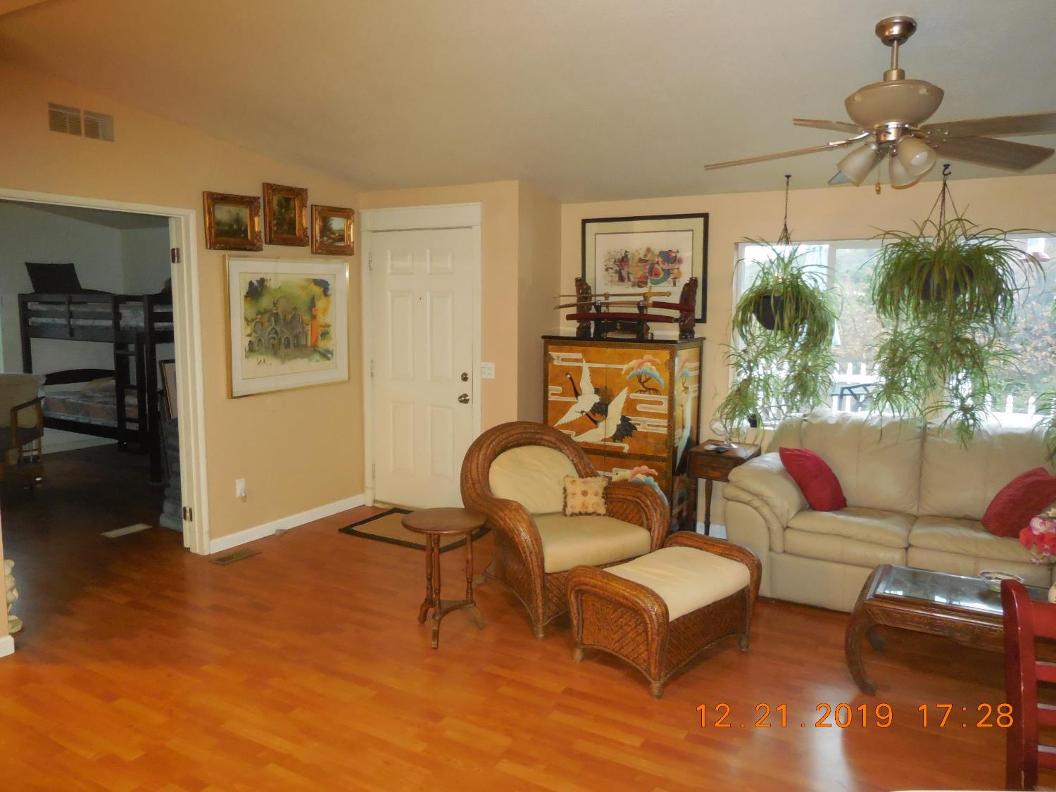 6067 Sheep Ranch Road Murphys, CA 95247 - Photo 17 of 44 a living room with furniture a rug and a chandelier