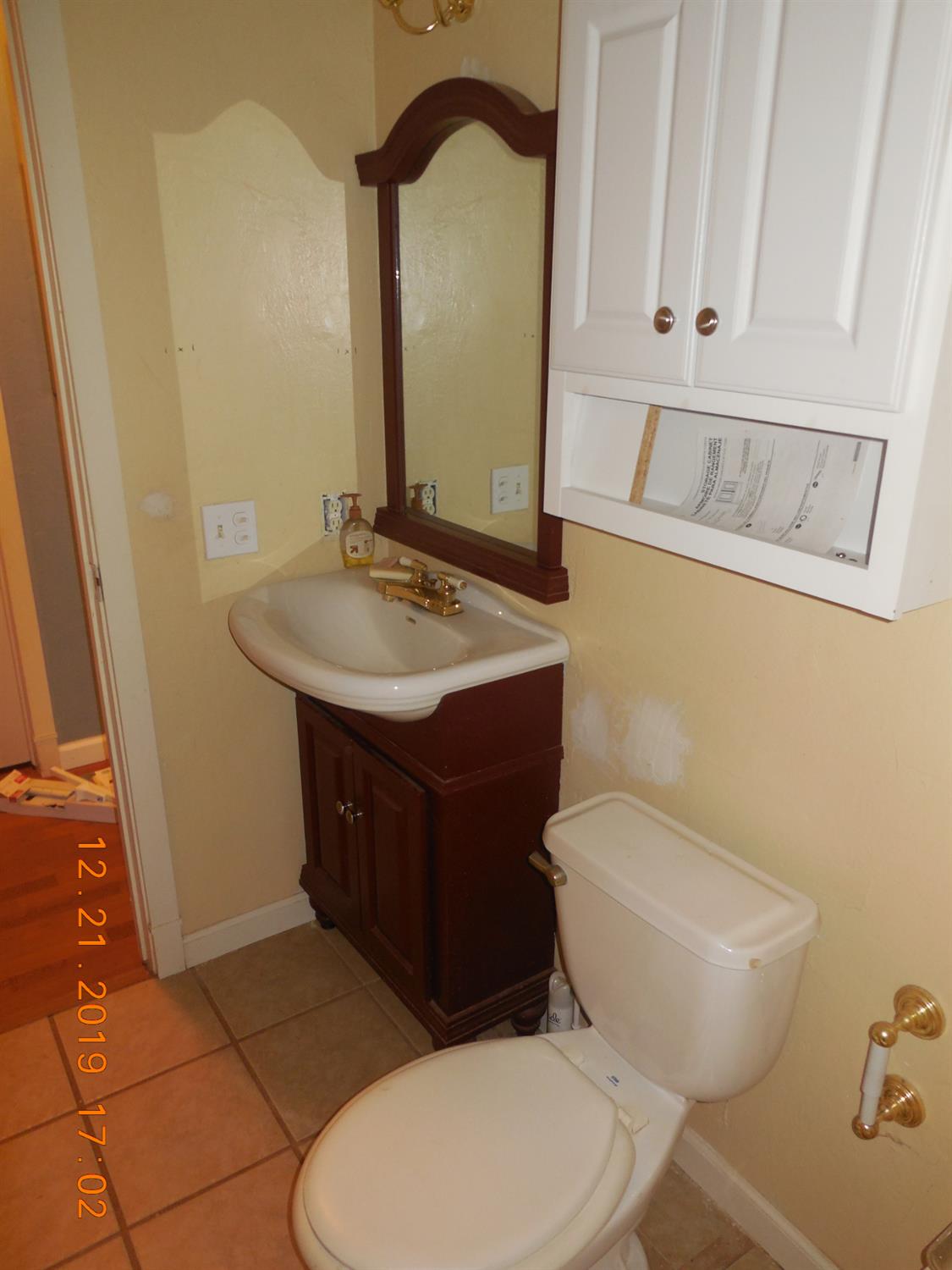 6067 Sheep Ranch Road Murphys, CA 95247 - Photo 33 of 44 a bathroom with a toilet sink and mirror