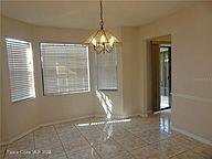 3716 Ranger Street Titusville, FL 32796 - Photo 2 of 7 a view of an empty room with window and chandelier