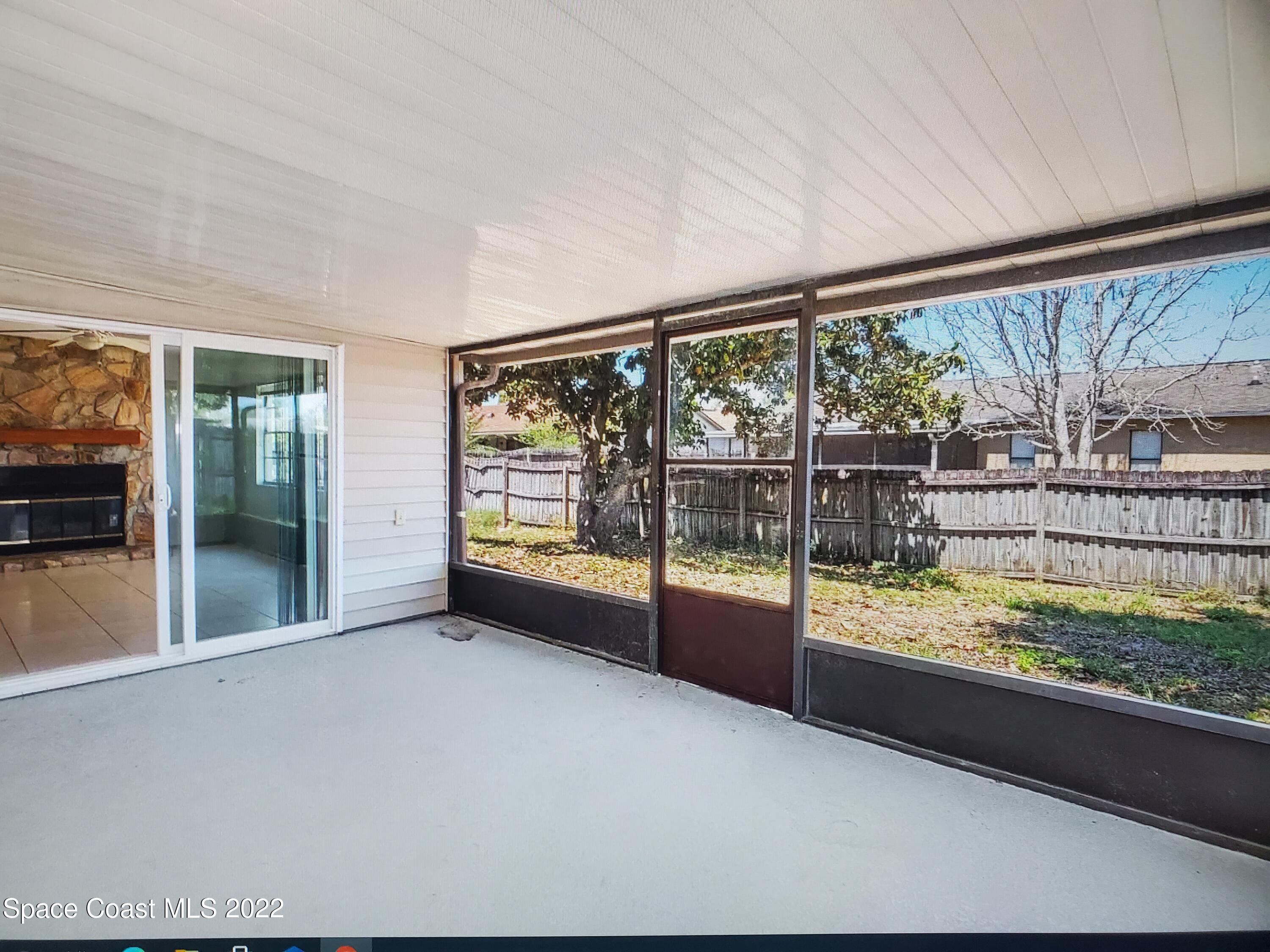 3716 Ranger Street Titusville, FL 32796 - Photo 7 of 7 a view of an empty room with a large window