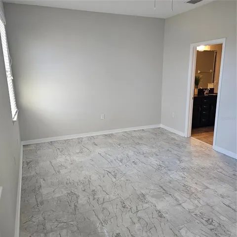 an empty room with a empty space and window