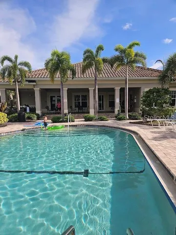 a view of a room with furniture and wooden floor