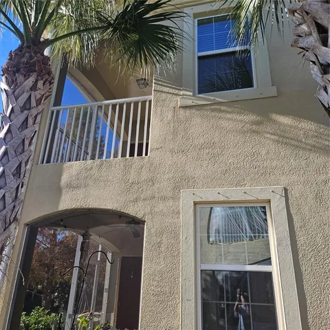 a view of balcony with small yard