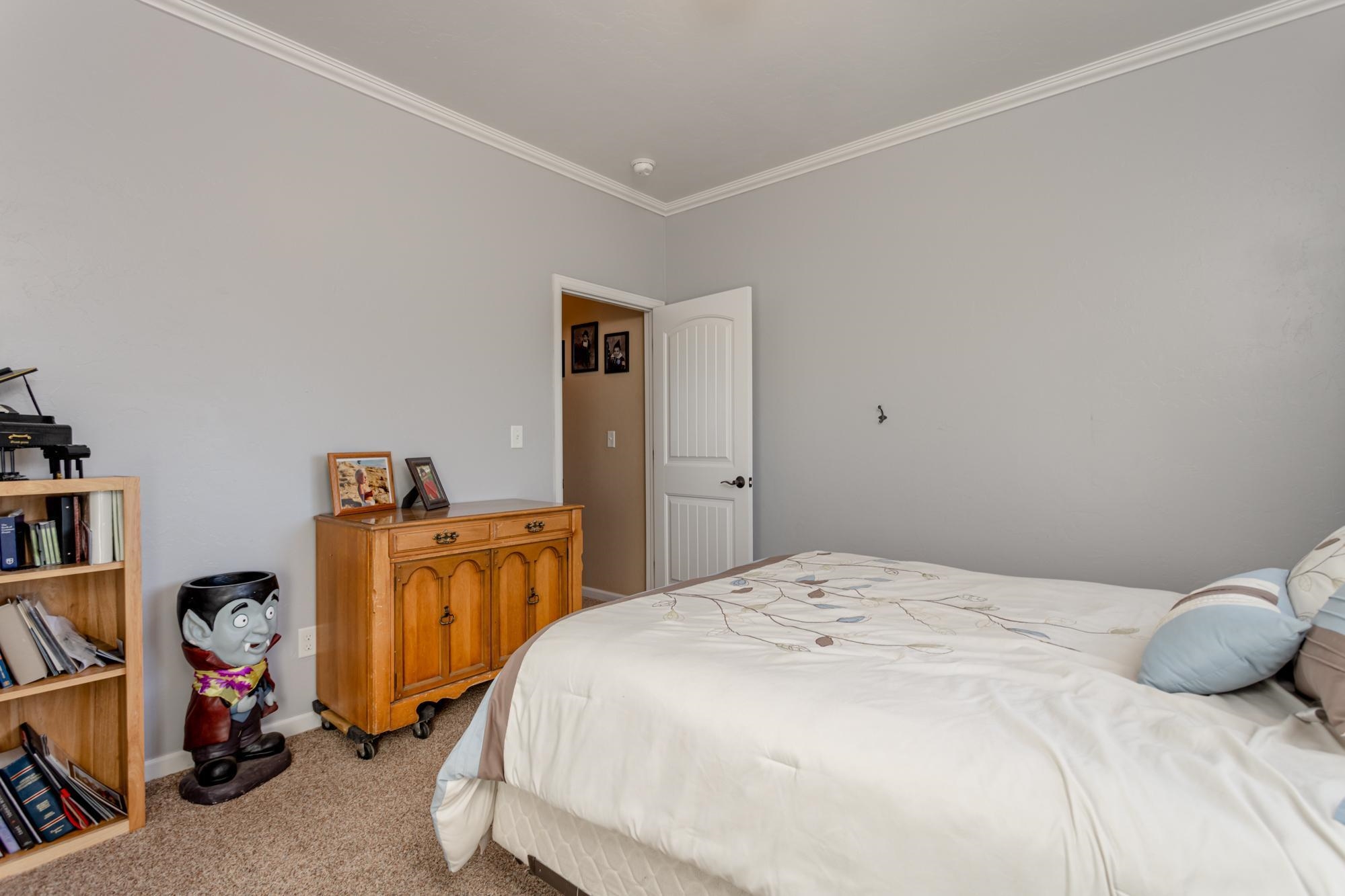 2041 Roma Avenue Fruita, CO 81521 - Photo 15 of 25 a bedroom with a bed and a storage