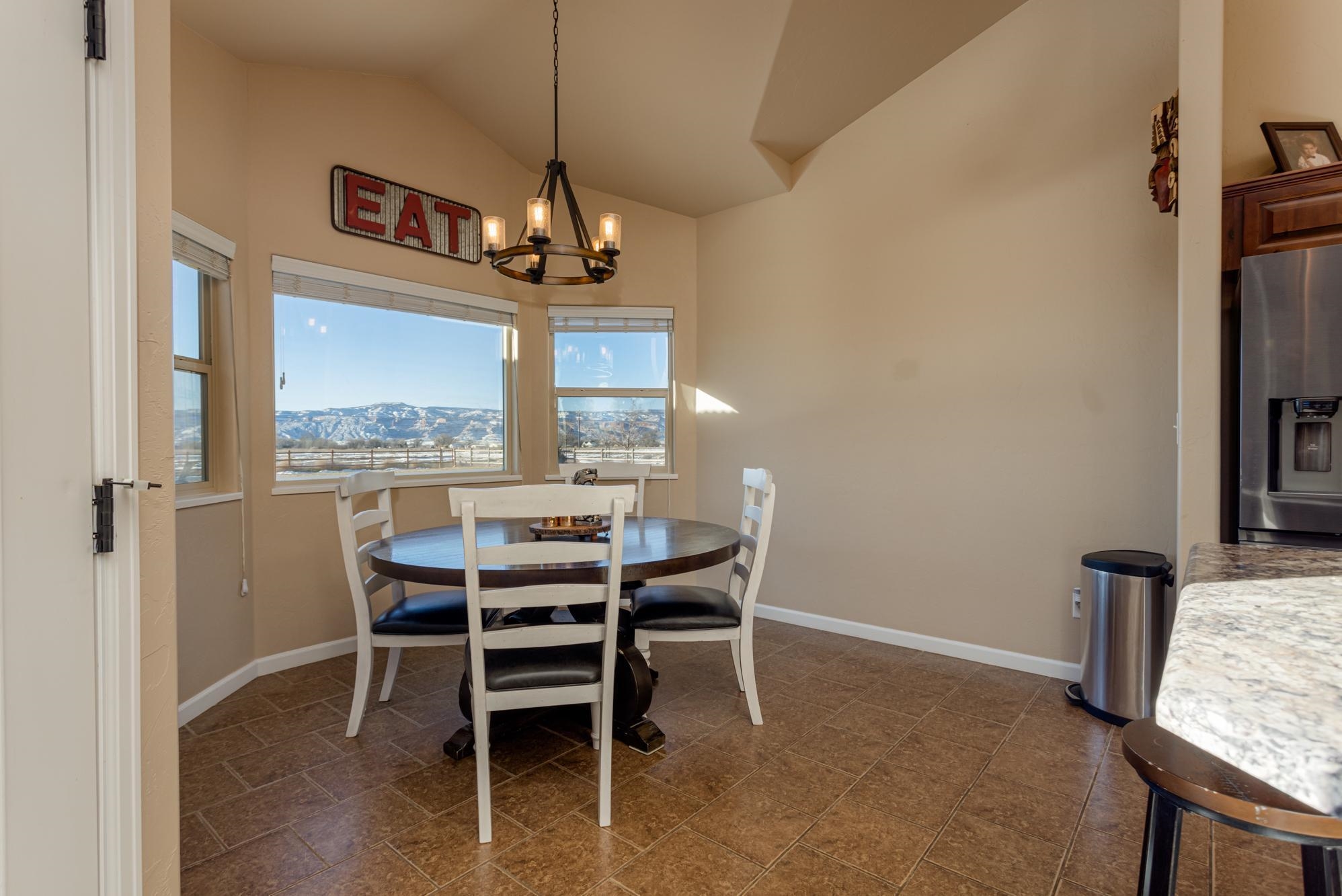 2041 Roma Avenue Fruita, CO 81521 - Photo 8 of 25 a dining room with furniture and window