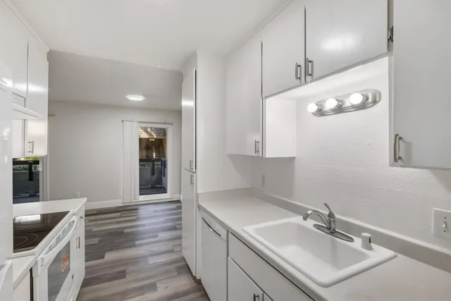 a bathroom with a sink a large mirror and vanity