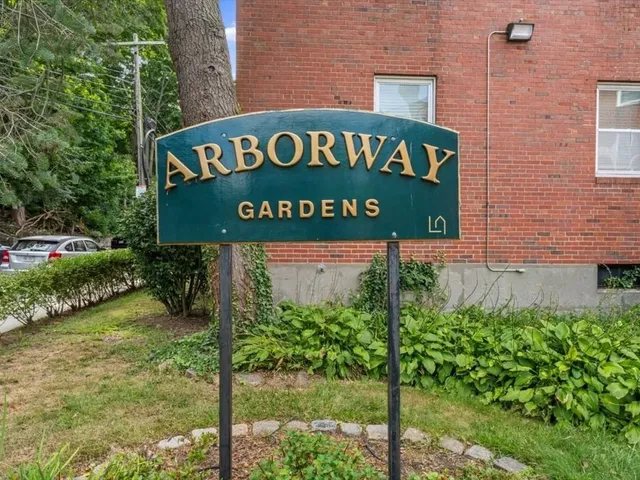 a sign broad on the brick wall