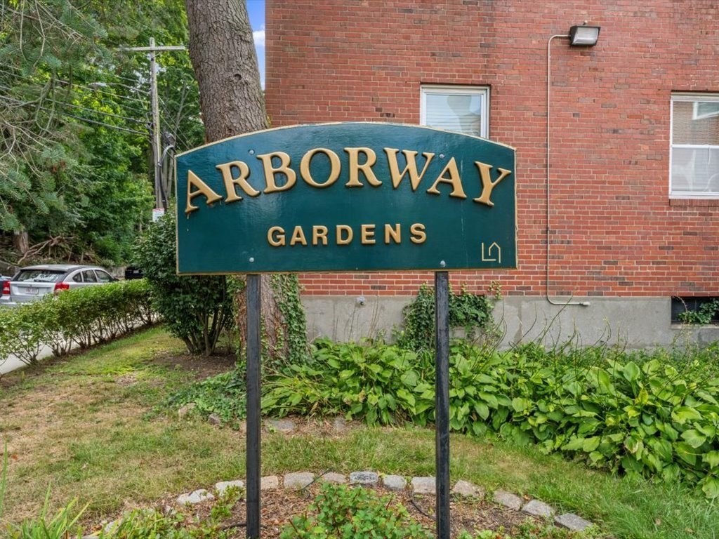1 Catenaccia Way, Unit 47 Boston, MA 02130 - Photo 18 of 27 a sign broad on the brick wall