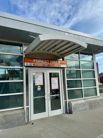 a view of an empty room with wooden shelves