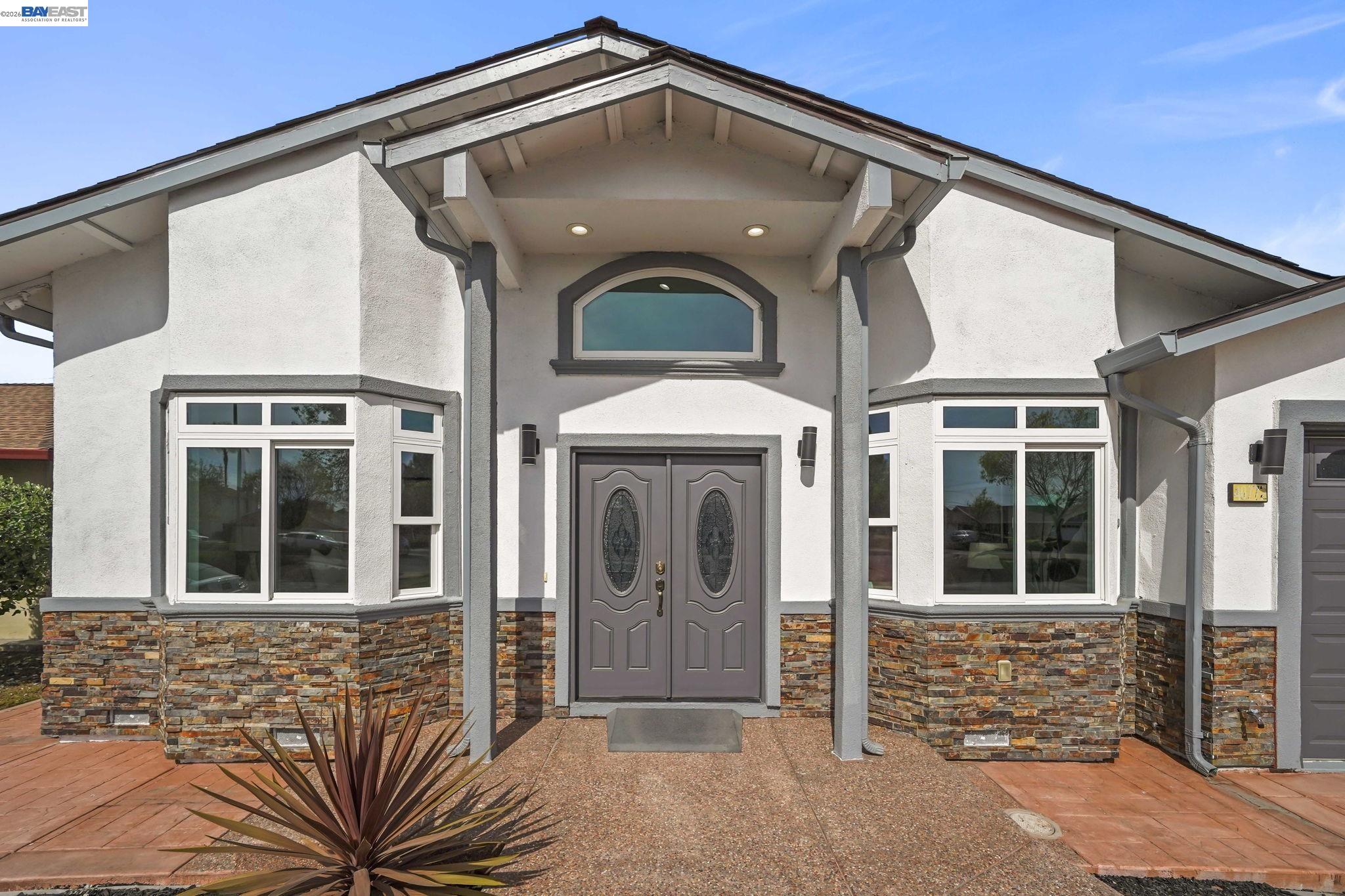 40772 Blacow Road Fremont, CA 94538 - Photo 6 of 40 a front view of a house with a glass door