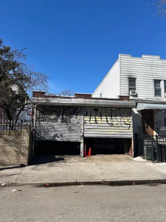 a front view of a house with a garage