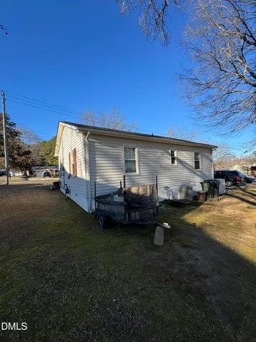 a view of a car in front of a house