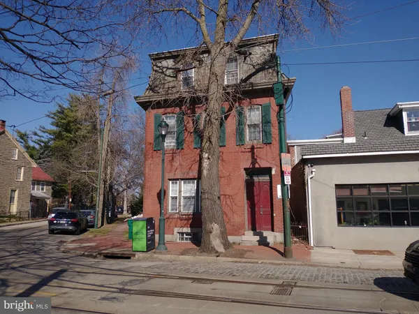 a view of a building with car parked