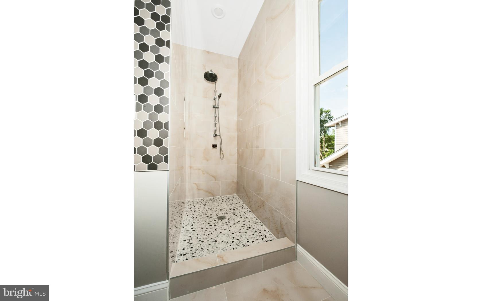 3224 Shelburne Road Baltimore, MD 21208 - Photo 14 of 26 a bathroom with a shower and a toilet