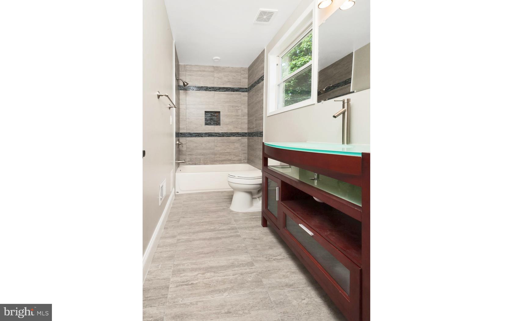 3224 Shelburne Road Baltimore, MD 21208 - Photo 4 of 26 a en suite bathroom with a sink and a mirror