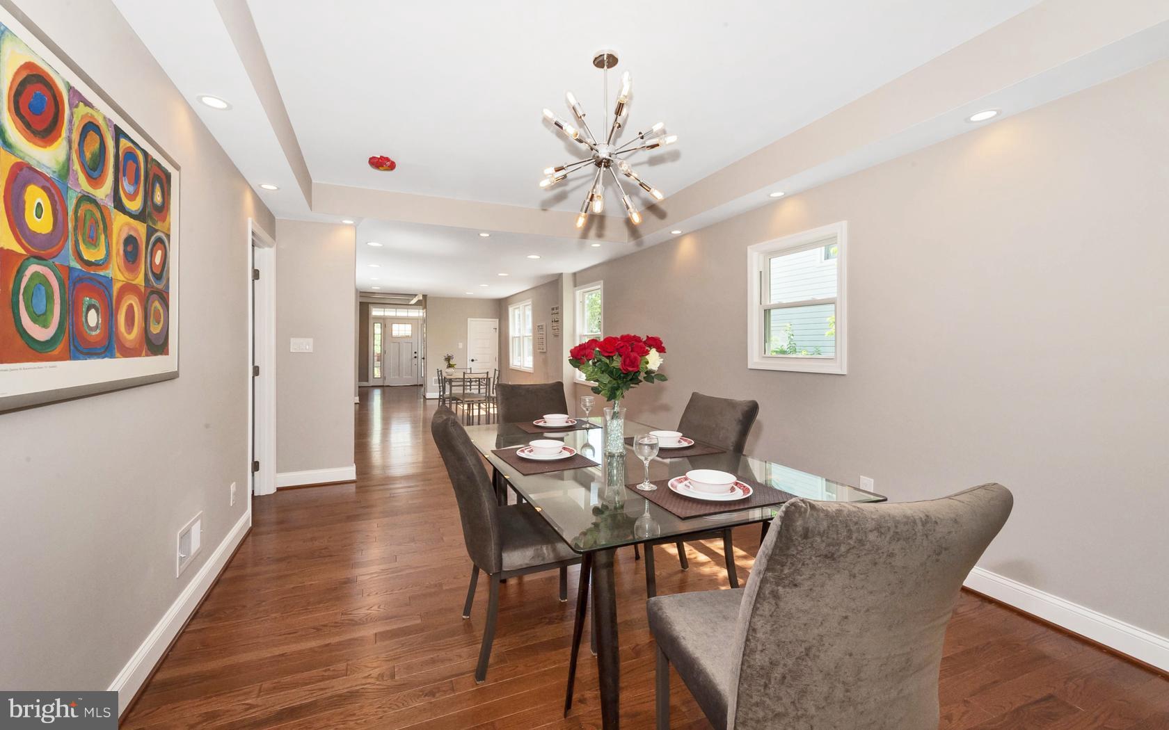 3224 Shelburne Road Baltimore, MD 21208 - Photo 8 of 26 a view of a dining room with furniture and a chandelier