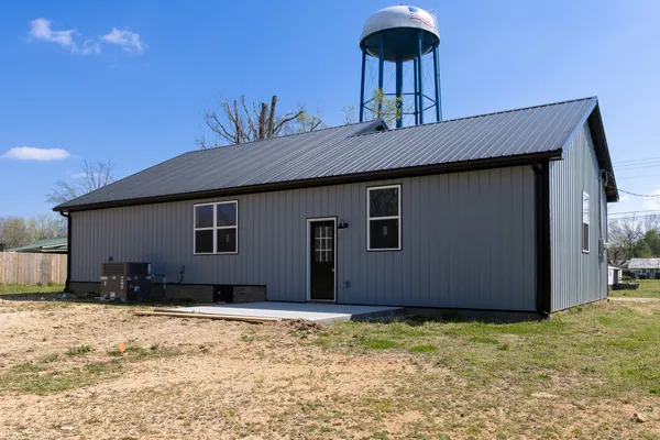a house with trees in the background