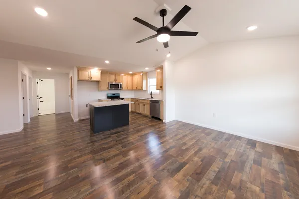 a view of a kitchen with a sink and a stove top oven