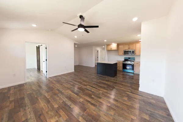 a view of a kitchen with a sink and a stove