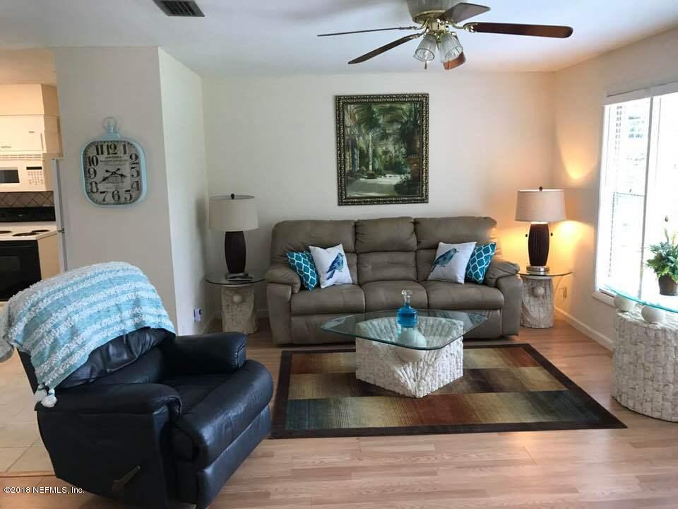 5412 Community Road Jacksonville, FL 32207 - Photo 3 of 17 a living room with furniture and a potted plant