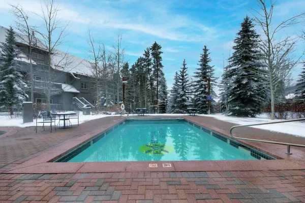 a view of a swimming pool with a patio