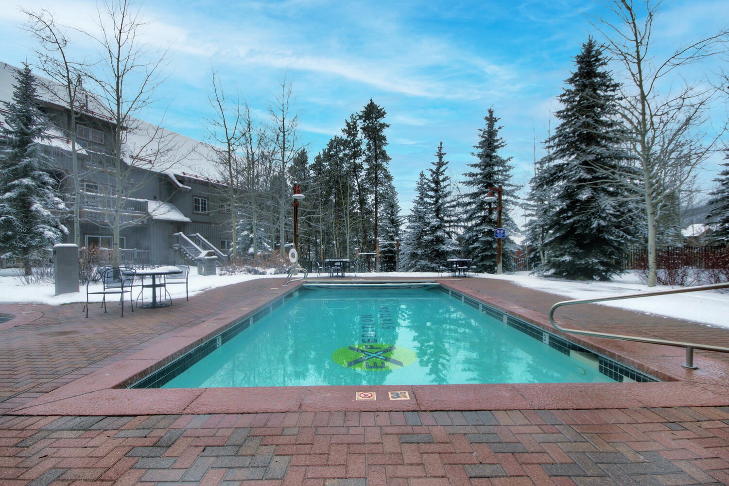135 Dercum Drive, Unit 8563 Keystone, CO 80435 - Photo 19 of 35 a small pool with trees in the background