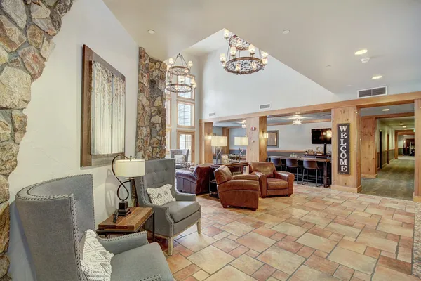 a living room with furniture and a large window