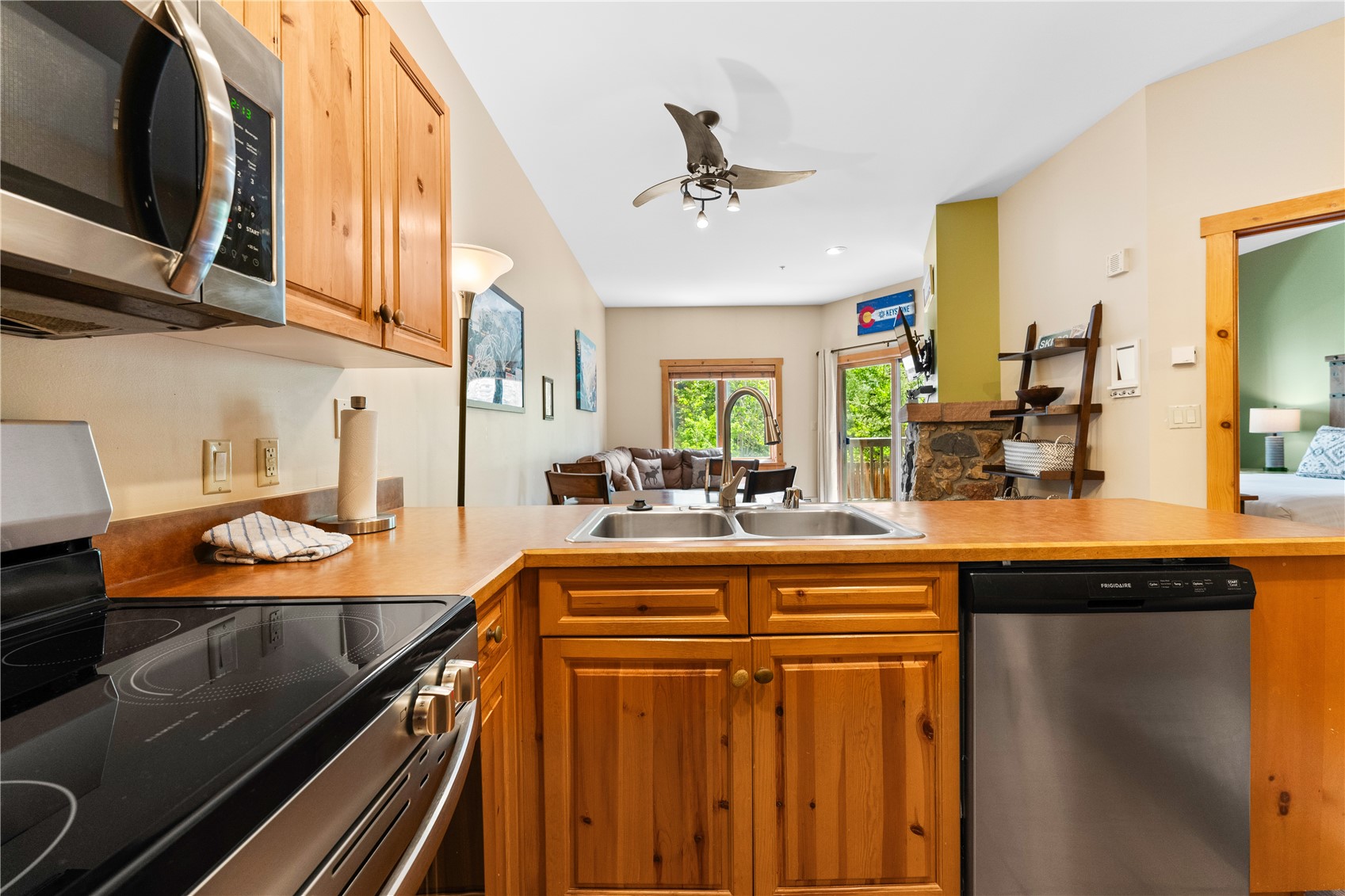 135 Dercum Drive, Unit 8563 Keystone, CO 80435 - Photo 7 of 35 a kitchen with stainless steel appliances a sink stove and cabinets