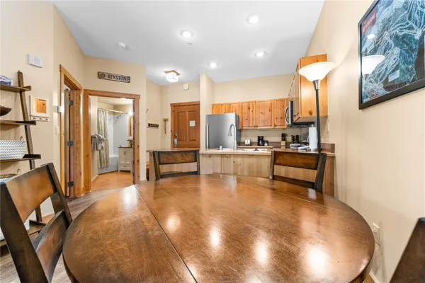 a view of kitchen and dining area with chandelier