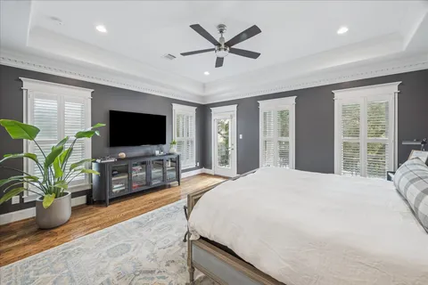 a bedroom with a bed and a flat screen television