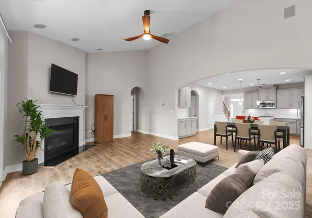 a living room with furniture fireplace and a flat screen tv