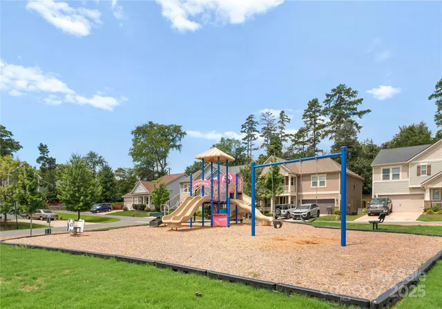 a view of a house with backyard porch and sitting area