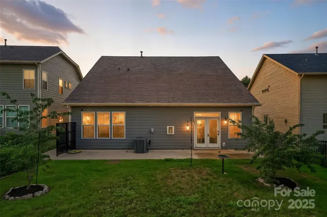 an aerial view of a house with outdoor space