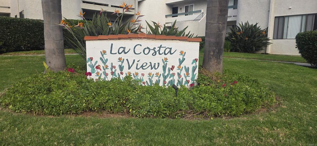 2306 Altisma Way, Unit 116 Carlsbad, CA 92009 - Photo 14 of 17 a sign on the side of the road