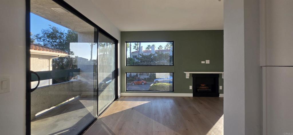 2306 Altisma Way, Unit 116 Carlsbad, CA 92009 - Photo 4 of 17 a view of an empty room and window