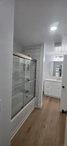 a living room with furniture and a shower